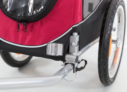 Schwarzer und roter Fahrradanhänger von Trixie für Haustiere